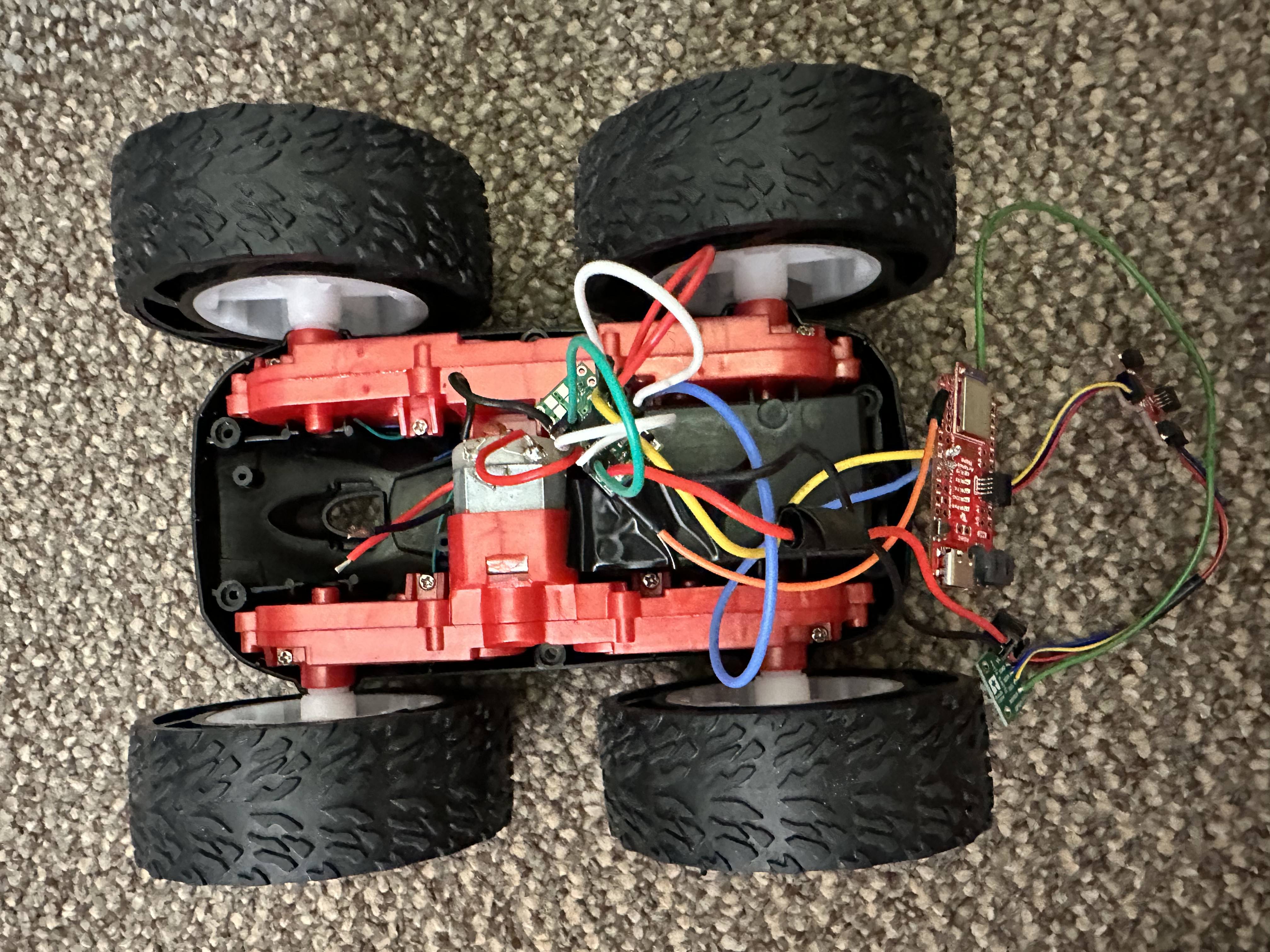 Picture of RC car taken apart with motor connected to motor driver